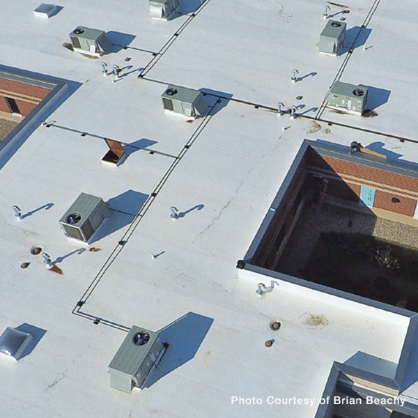 Commercial Roof Types with White Reflective Cool Roof Coating