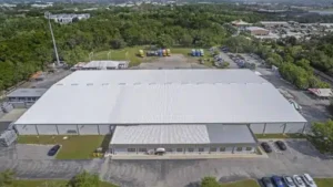 Aerial view of a completed commercial roof replacement in Florida handled by a licensed and insured roofing contractor