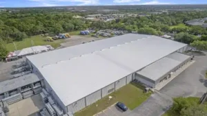 Large Florida commercial building with a metal roof, the type of project to question roofing contractors about