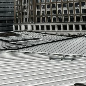 Durable commercial metal roofing system designed to withstand strong hurricane winds and heavy rainfall.