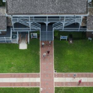 Top-down view of a wooden building with shingle roofing.