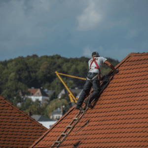 A roofer reinforcing a hurricane-resistant roof to withstand extreme weather conditions.