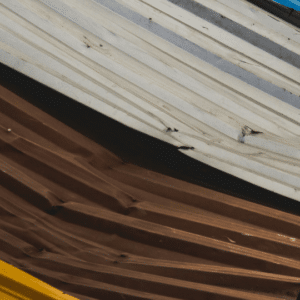 a close-up of warped metal roof panels showing signs of oil canning, which can affect both aesthetics and water drainage efficiency.