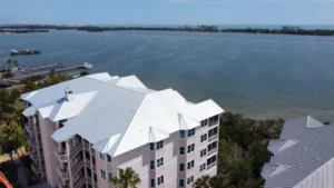 Coastal Florida commercial building with a white metal roof exposed to hurricane and storm damage risk