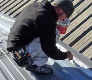 Conklin Roof Maintenance Guide with contractor applying sealant