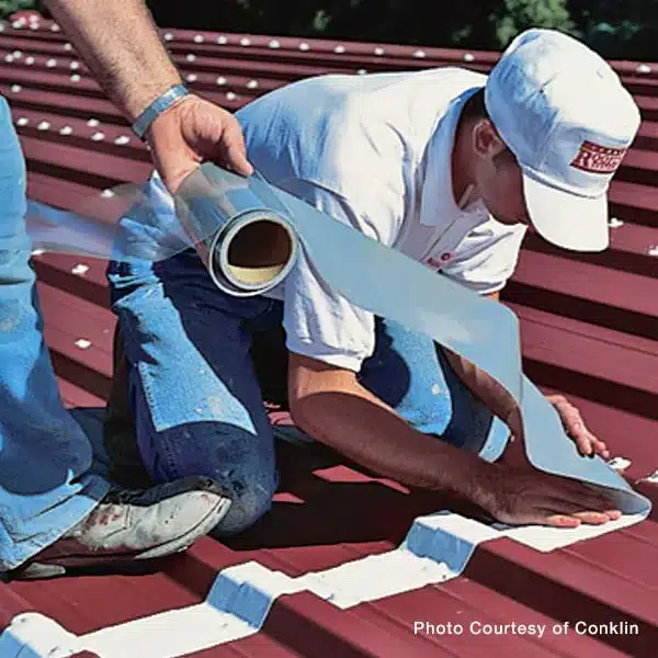 Metal roof repair and restoration in action