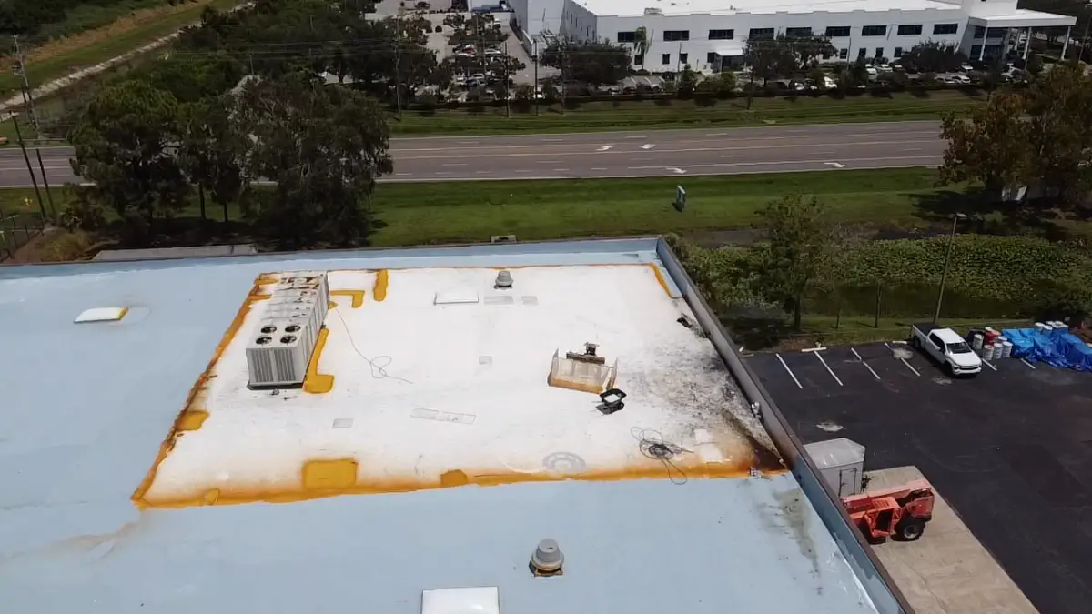 A low-slope roof that’s been severely damaged by repeated water ponding.