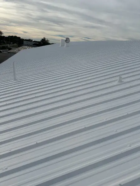 White reflective metal roof after restoration on Sarasota commercial building