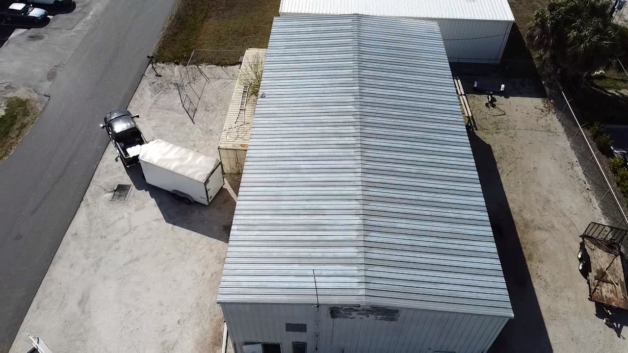 Aerial view of the same industrial roof prepped for spray polyurethane foam application